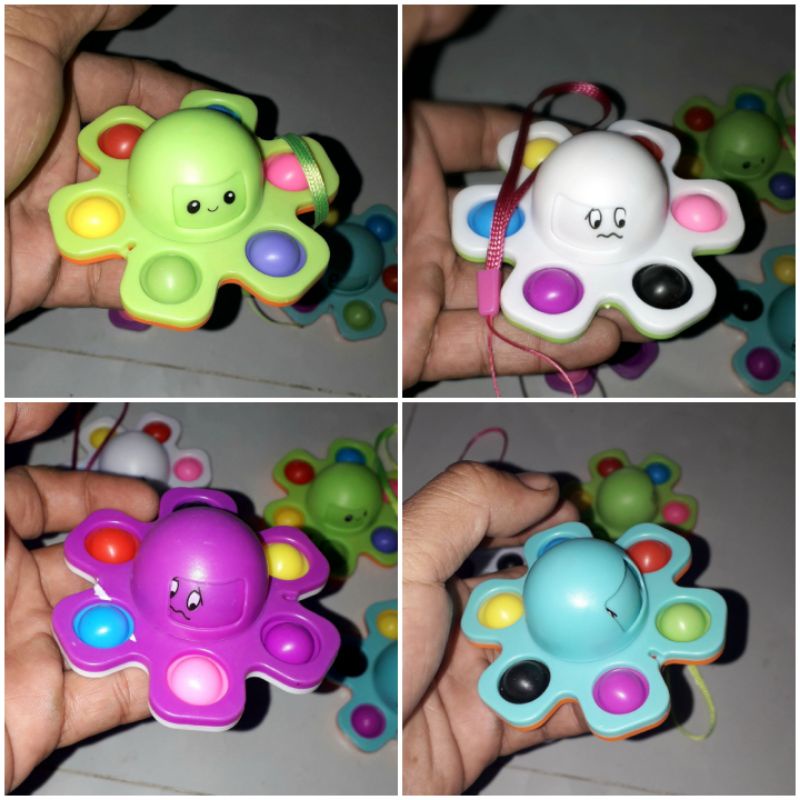 Một cái con quay xả stress pop it bằng nhựa rất đẹp có kèm dây