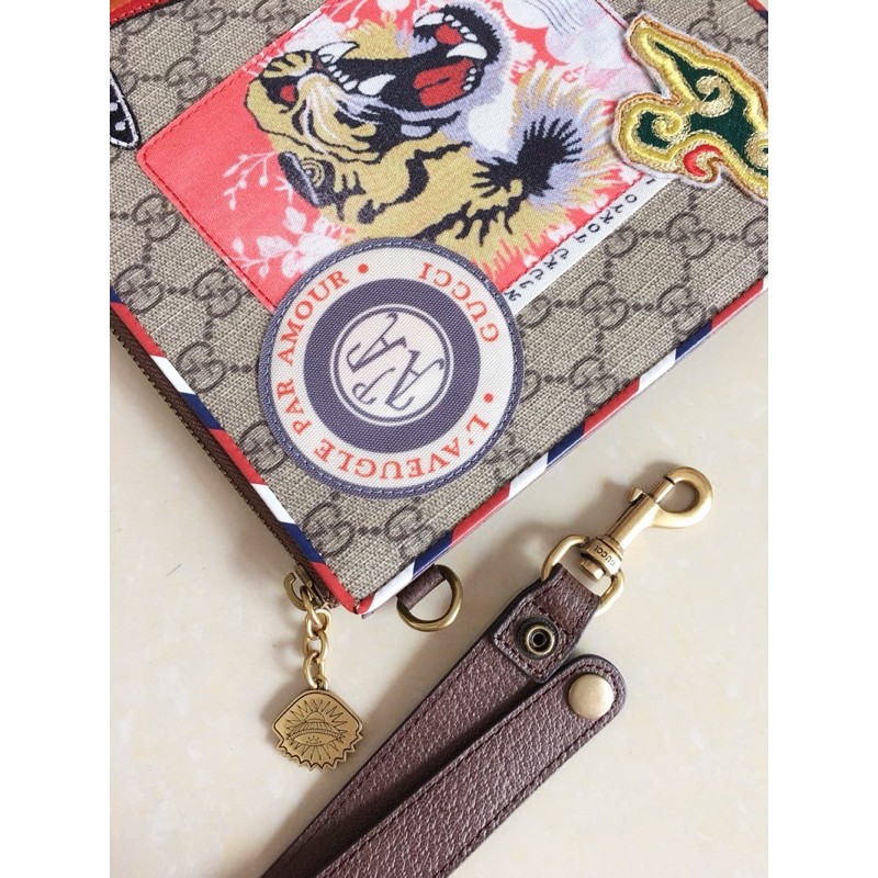 Clutch cầm tay hiệu Gucci GG da thật cao cấp có đính nhiều sticker