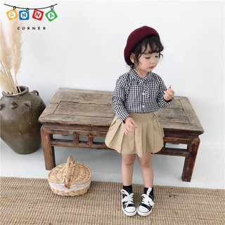Áo sơ mi kẻ buộc nơ cổ bé gái.