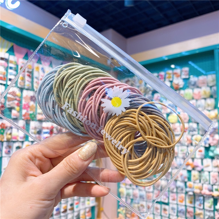 Set 100 Dây Buộc Tóc(Loại Túi Zip Hoa Cúc Mới)