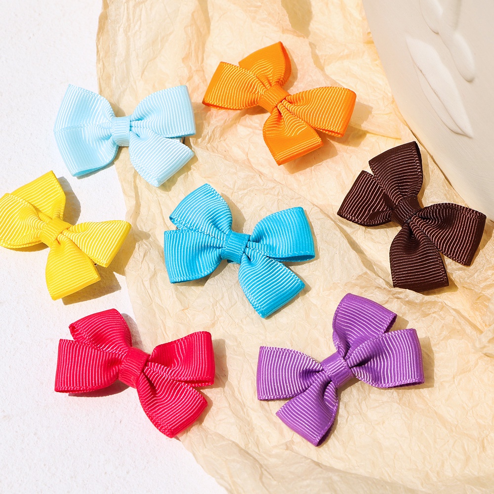 Set 10 kẹp tóc nơ KIDSBOWS bằng kim loại màu trơn phong cách Hàn Quốc thời trang cho bé gái