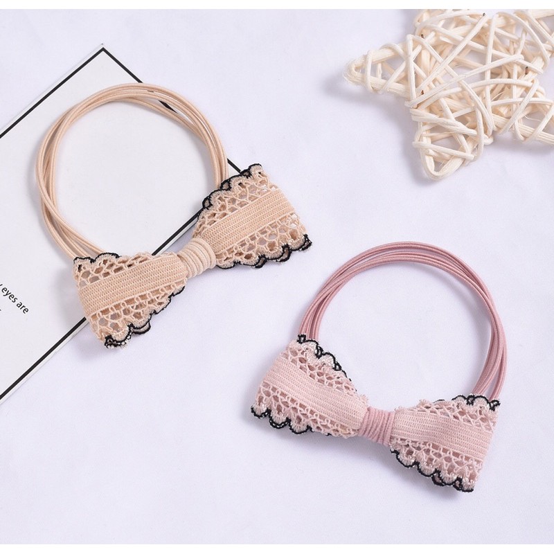 Thun buộc tóc hình nơ