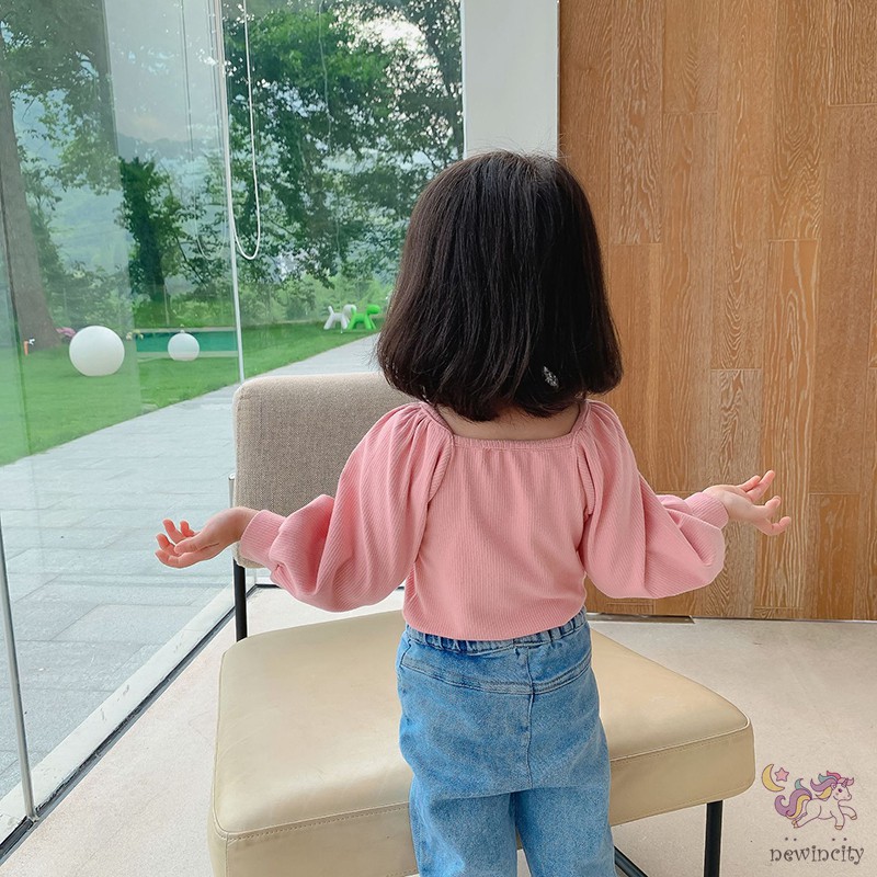 Áo dài tay phối nơ phong cách đáng yêu dành cho bé gái