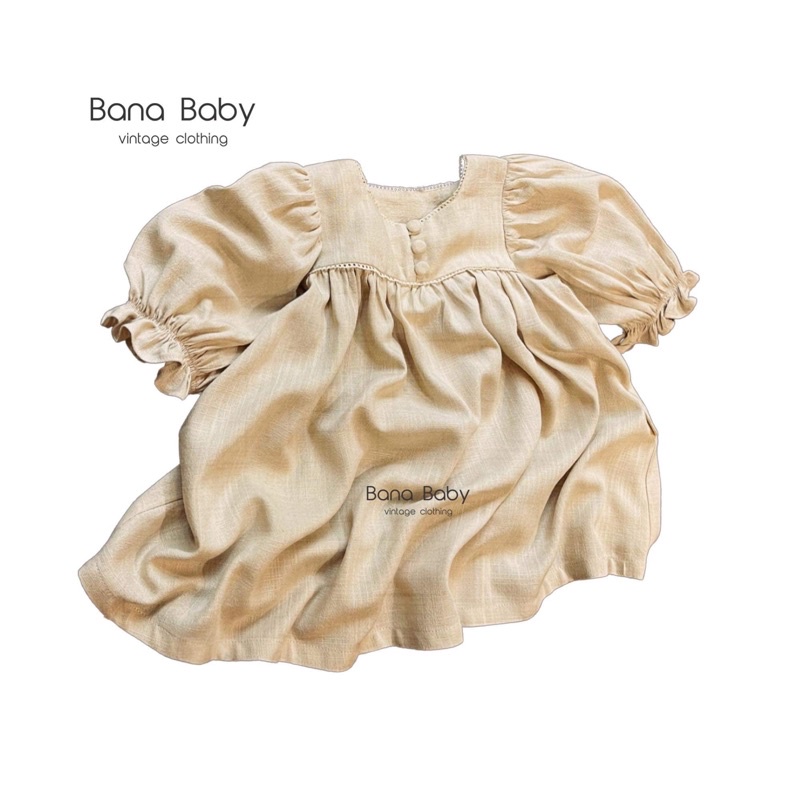 Váy babydoll cổ vuông mix ren khuy tròn Bana Baby, chất linen xước, vải đã wash, màu be.
