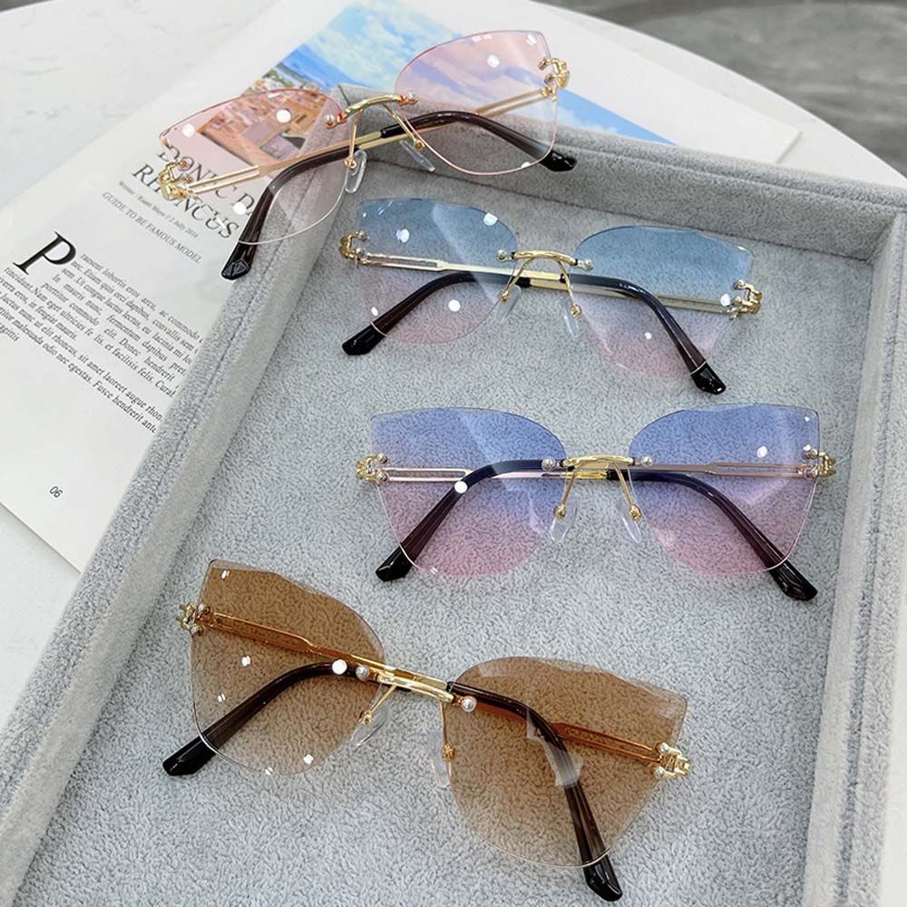 Kính râm mắt mèo không gọng chống tia UV phong cách Hàn Quốc dành cho nam và nữ