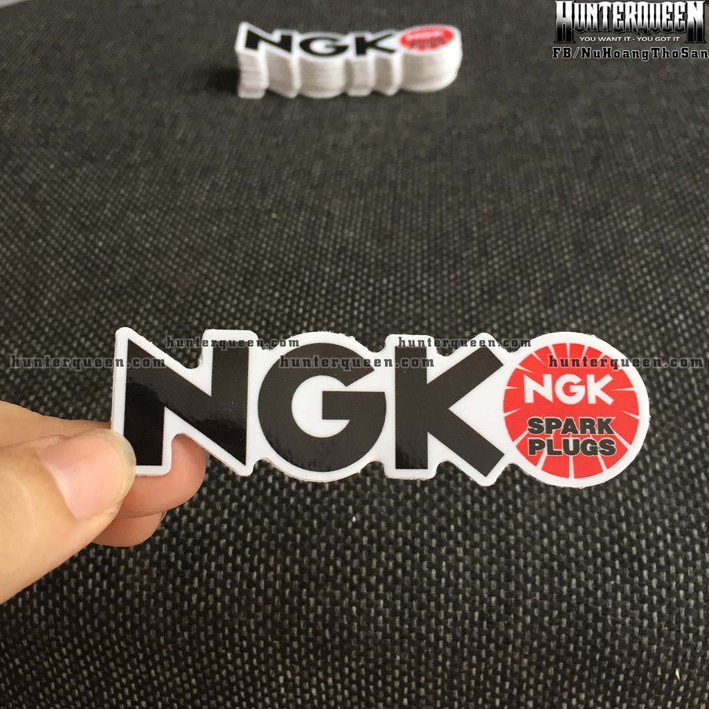 NGK[8.5X2.4cm] decal cao cấp chống nước, sắc nét, bền màu, dính chặt. Hình dán logo trang trí mọi nơi, in theo yêu cầu