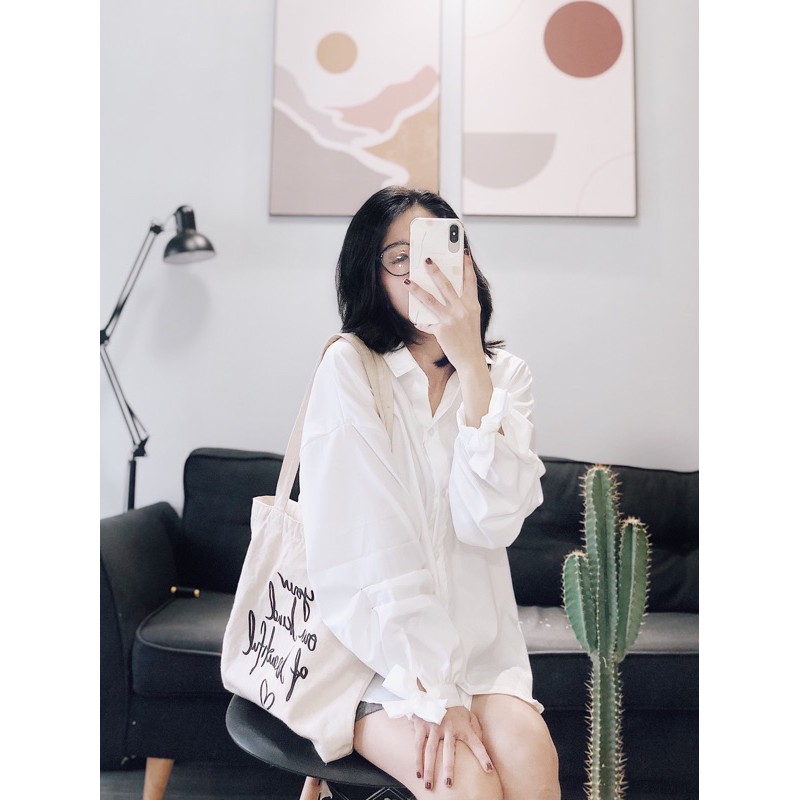 sơ mi trắng nhún xếp li tay và cột nơ