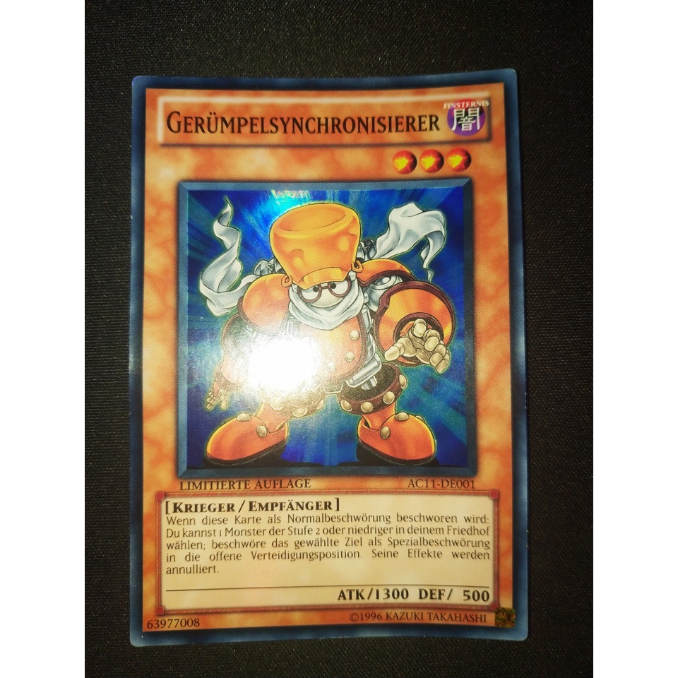 Thẻ bài Yugioh - TCG (DE) - Gerumpelsynchronisierer / AC11-DE001'