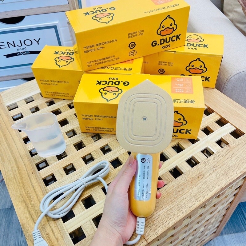 Bàn ủi mini du lịch cầm tay hình con vịt vàng G. DUCK hottrend - Bàn là hơi nước du lịch con vịt vàng mẫu mới 2021.