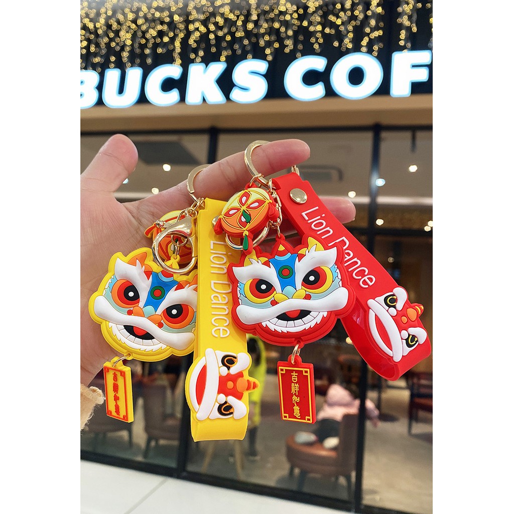 Móc khóa nhựa dẻo hình đầu Lân cá tính