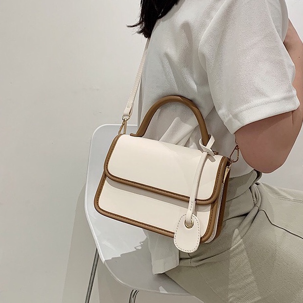 Túi xách nữ cầm tay, da trơn phối viền nổi bật hàng mới 2022 SL37