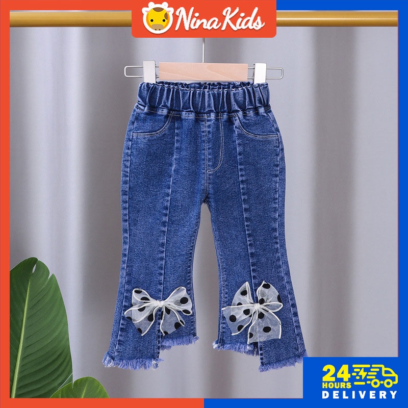 Quần jeans  ống loe đính nơ cho bé gái 1-7 tuổi