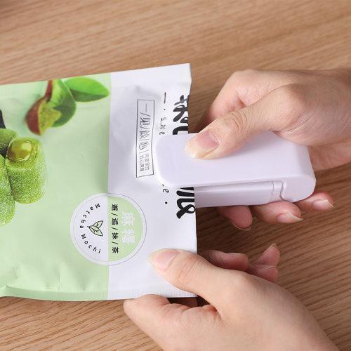 máy dán loại áp lực tay cầm mini đóng gói túi nhựa bao bì đồ ăn nhẹ gia đình nhỏ hàn niêm phong tạo tác