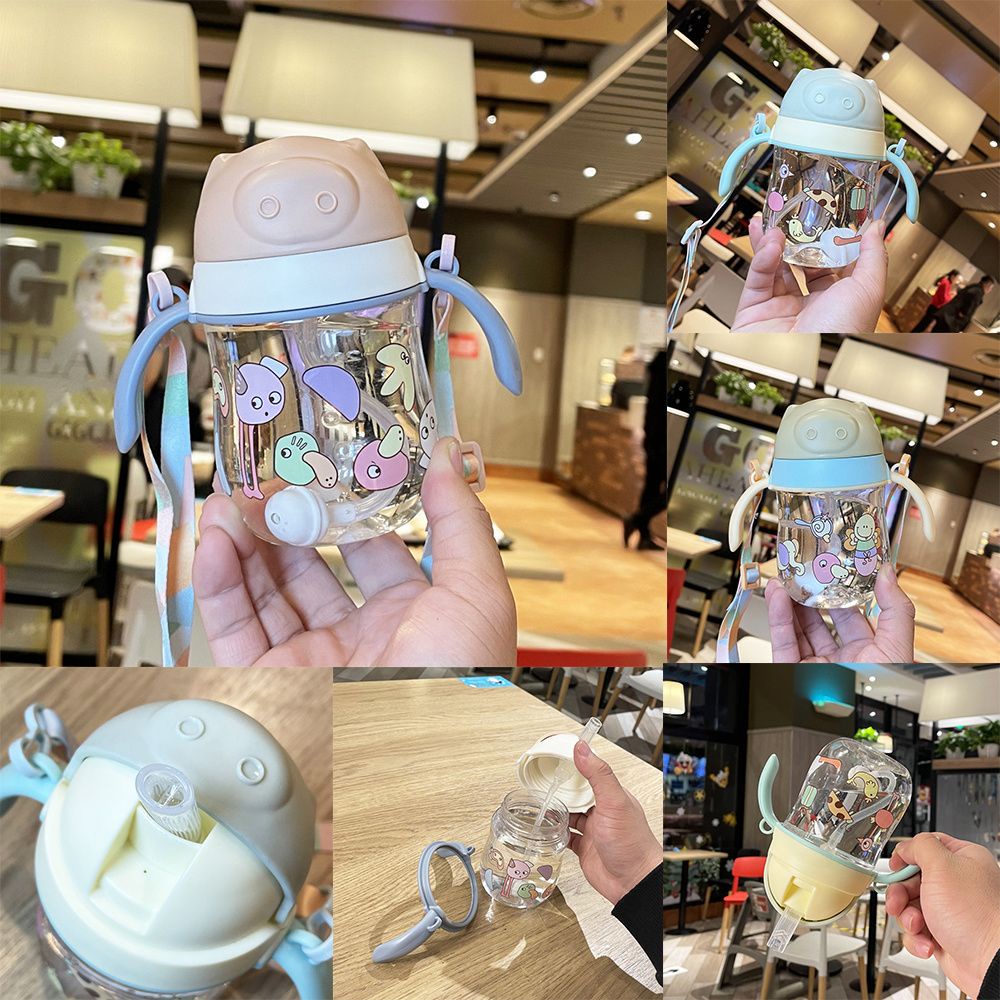 Bình uống nước 280ml có tay cầm và ống hút chống tràn họa tiết hoạt hình cho bé