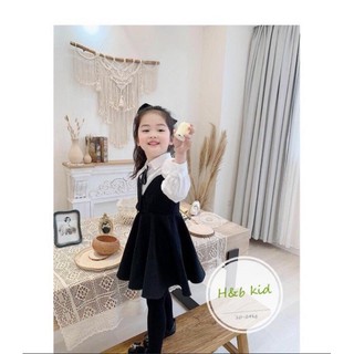 Xả váy đen trắng đính nơ bé gái,