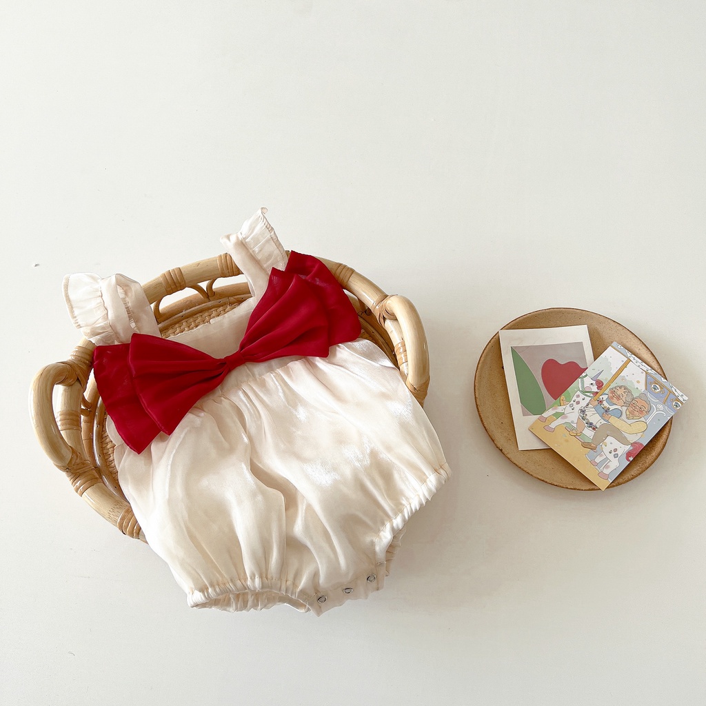 Body chip bé gái sơ sinh màu kem nơ đỏ xinh xắn ảnh thật