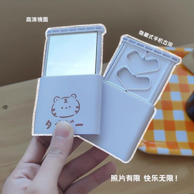 Gương bỏ túi có thể làm giá đỡ điện thoại