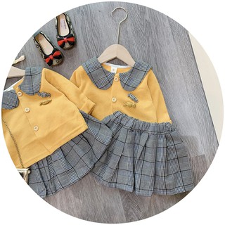 SET BÉ ÁO VÀNG MIX CHÂN VÁY KẺ