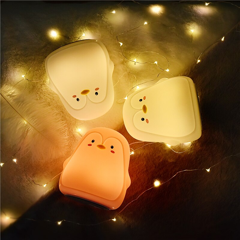 Đèn ngủ cảm ứng 7 màu bằng silicon sạc USB hình chim cánh cụt đáng yêu