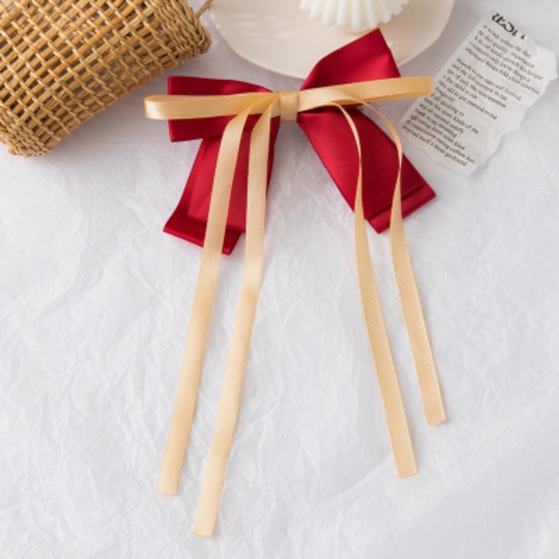 Kẹp tóc nơ nữ tính đơn giản và dễ thương