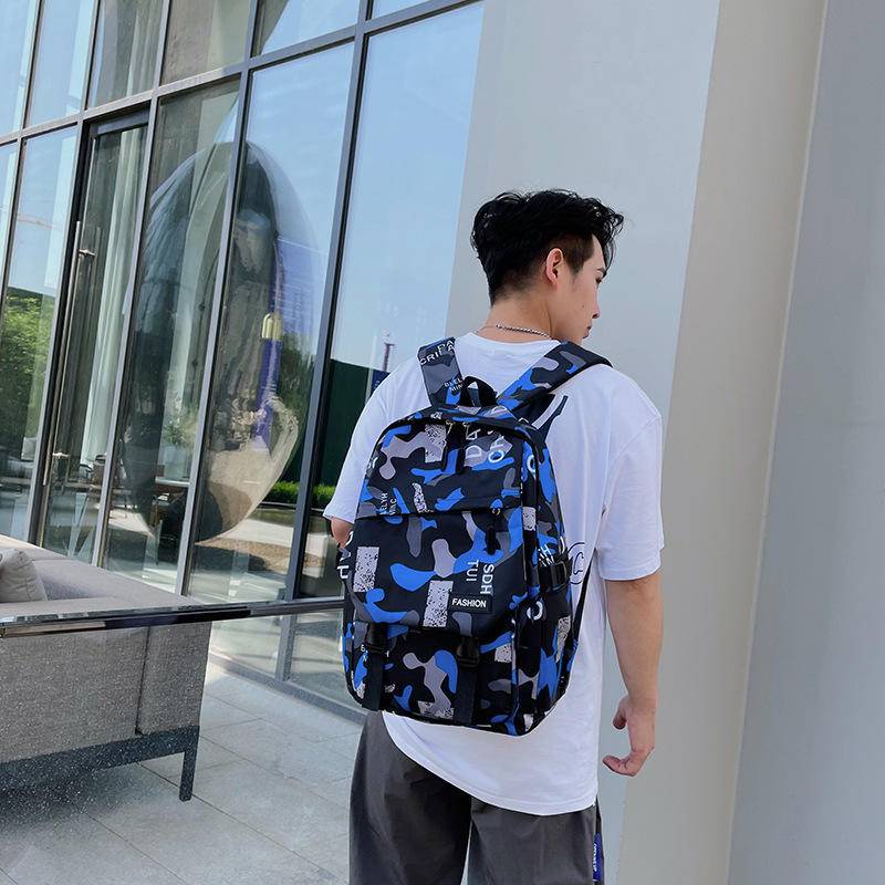 Boutique backpack ng balikat ng mga lalaki na malaking kapasidad ng kapasidad ng mga batang mag-aaral ng paaralan ng mga lalaki sa fashion tide bag.