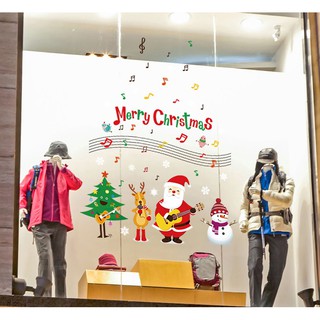 Decal dán tường Ông già noel đánh đàn