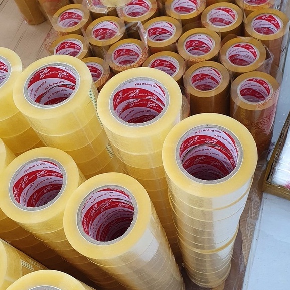 Băng dính 0.3kg/1 cuộn lõi giấy dán thùng giá xưởng