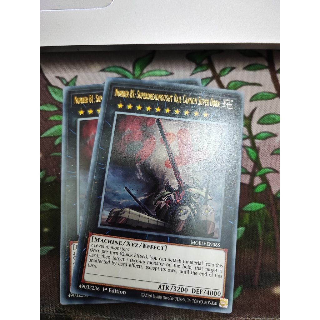 1 lá thẻ bài Number 81: Superdreadnought Rail Cannon Super Dora - MGED-EN065 - Rare 1st Edition
