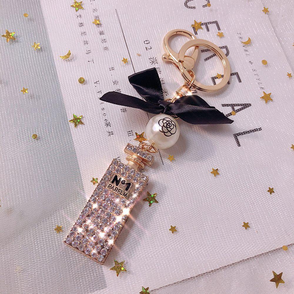Móc Khóa Hình Chai Nước Hoa Họa Tiết Chấm Bi Lấp Lánh Dễ Thương