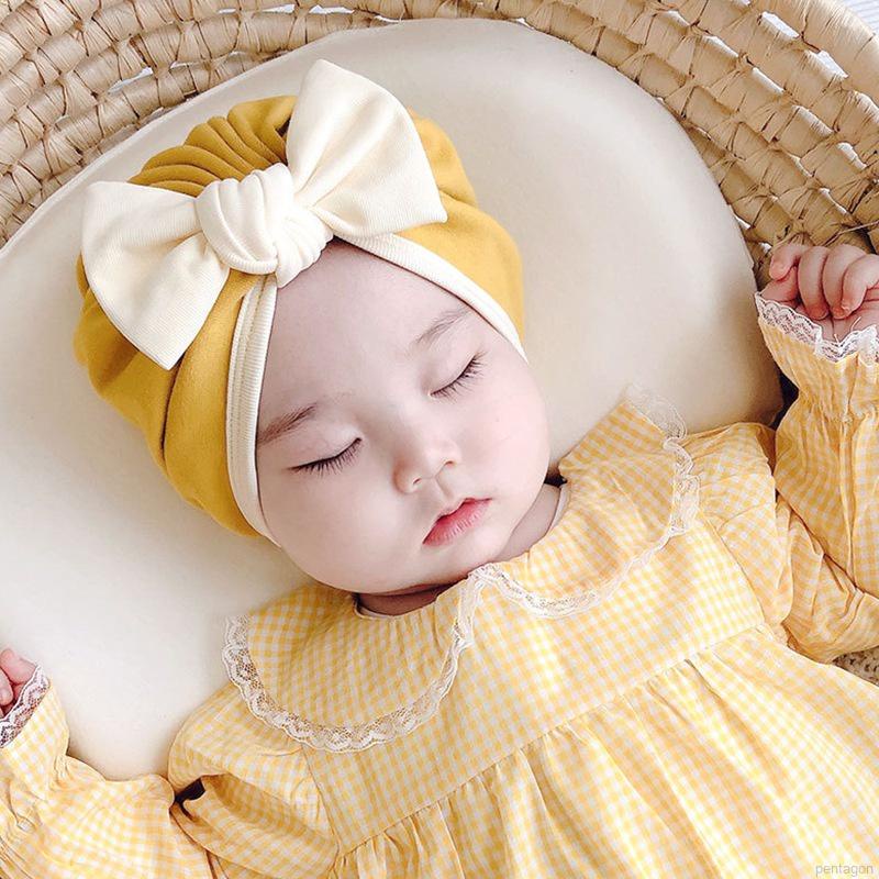 Mũ trùm đầu beanie đính nơ màu trơn đáng yêu dành cho trẻ em