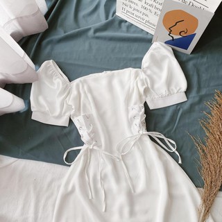 Đầm trắng cổ vuông đan dây eo
