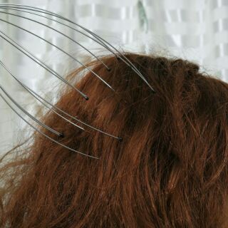 Dụng cụ matxa đầu