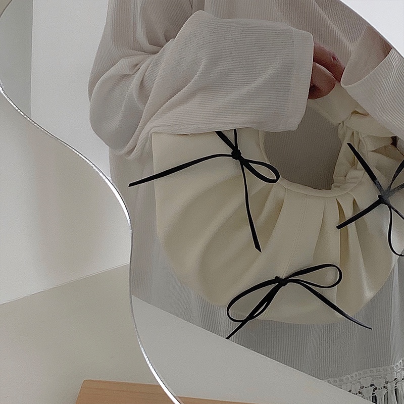 Túi xách tròn nhỏ đính nơ thời trang cho nữ