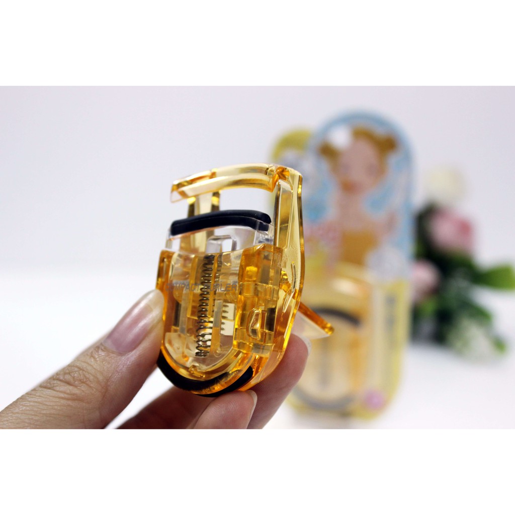 Uốn mi cong thân nhựa KAI màu hồng, xanh, vàng