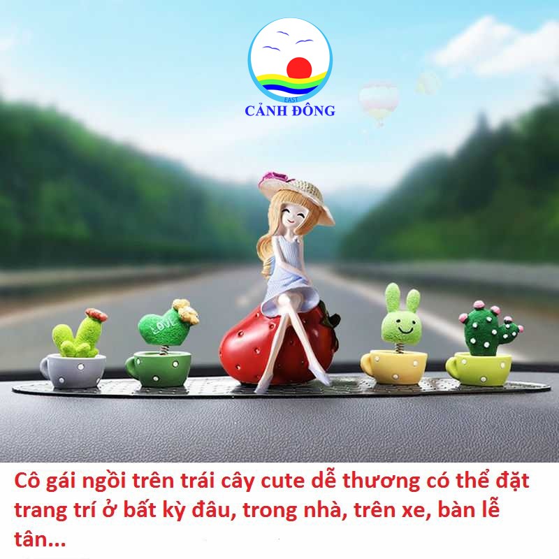 Tượng cô gái dễ thương ngồi trên trái cây mùa hè