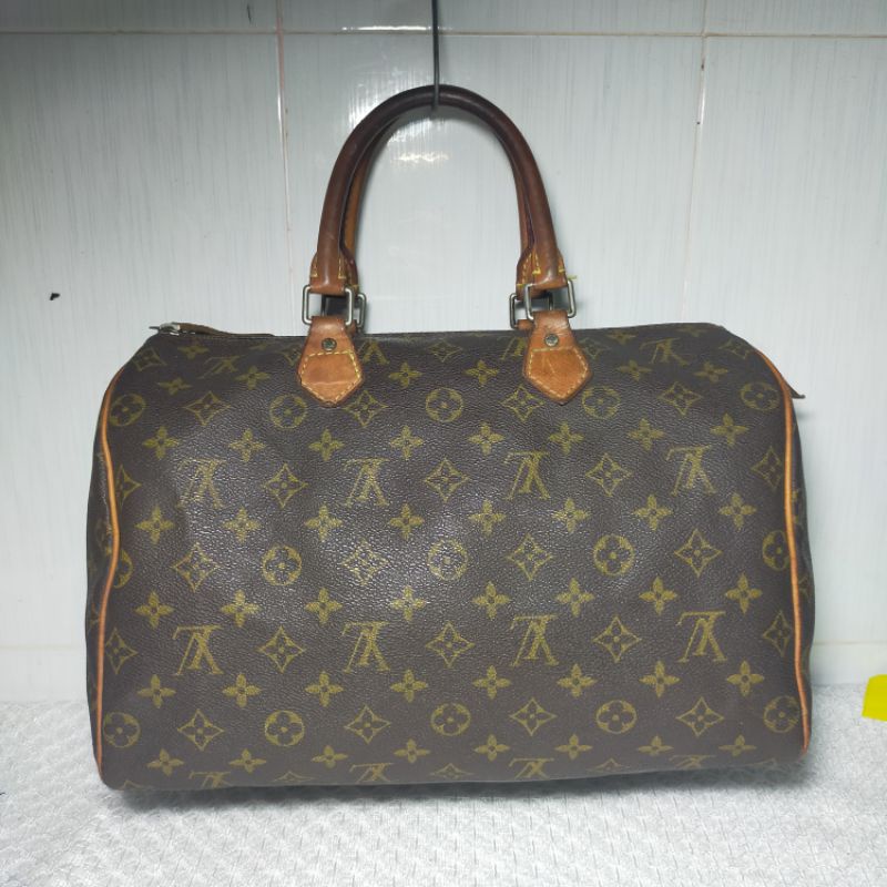 Túi xách si hiệu eo Vì