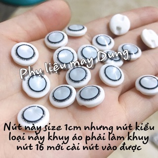Nút trắng đục viền đen size 1cm