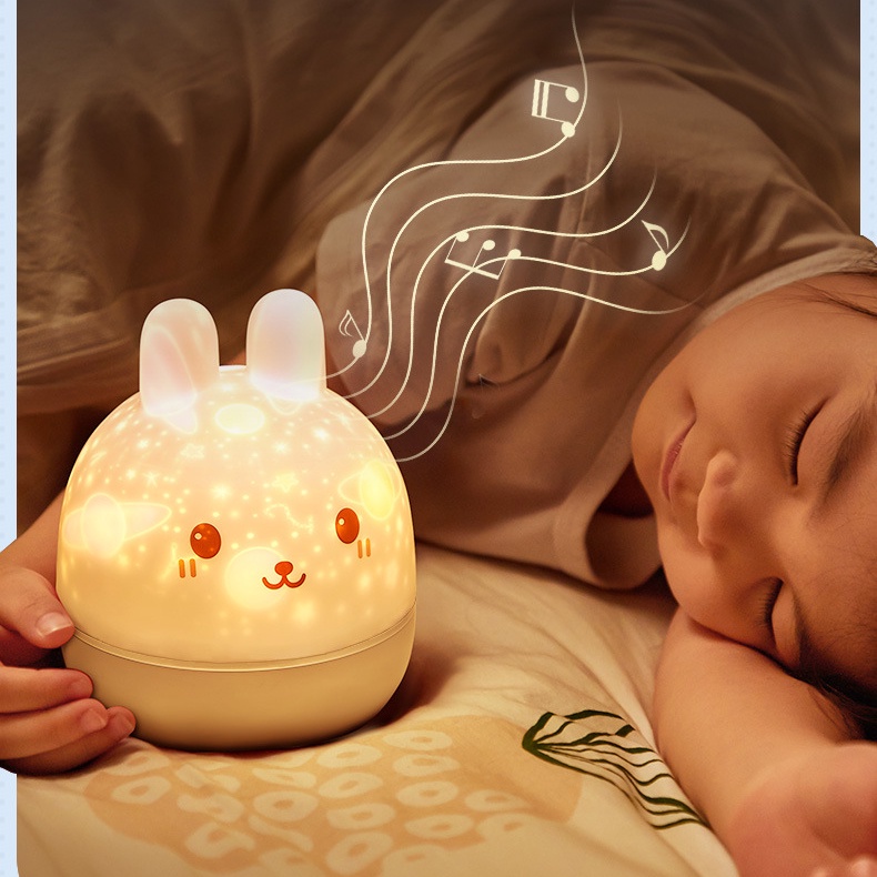 Đèn ngủ để bàn chiếu sao 3d, đèn ngủ ngàn sao chiếu nắp THỎ CON ĐEO NƠ hình decor xoay tự động phát nhạc - HUNONA