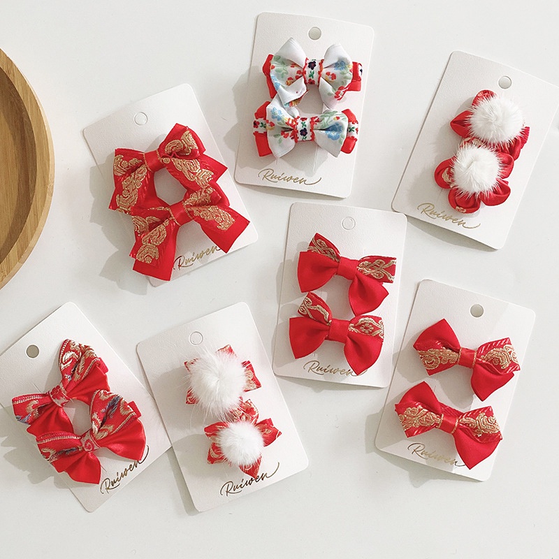 Bộ 2 kẹp tóc màu đỏ xinh xắn nhiều kiểu dáng làm quà tặng mừng năm mới cho bé gái