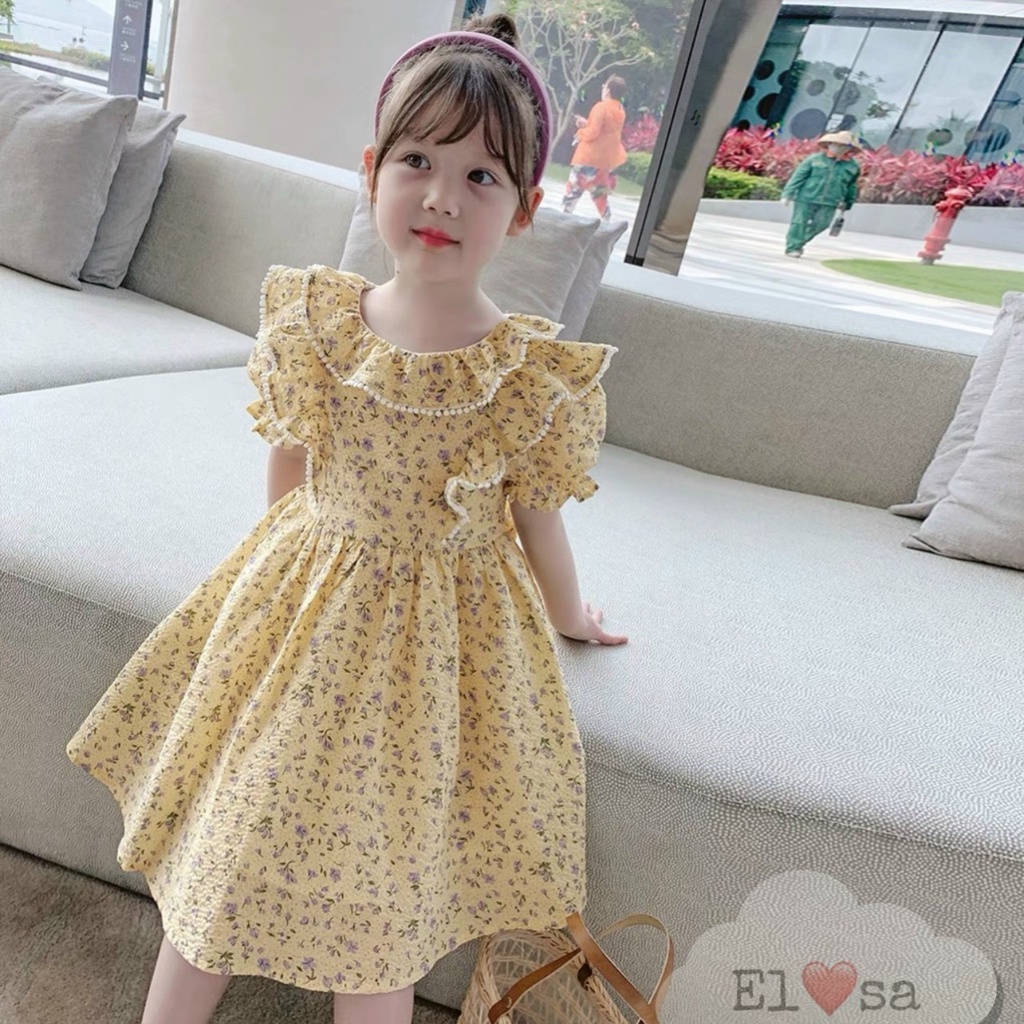 Váy hoa nền vàng bèo phối cho bé