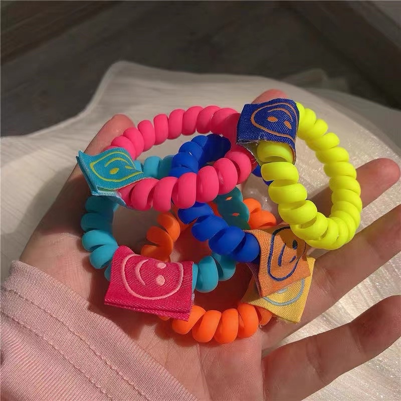 Cột tóc dây soắn maud neon hình mặt cười