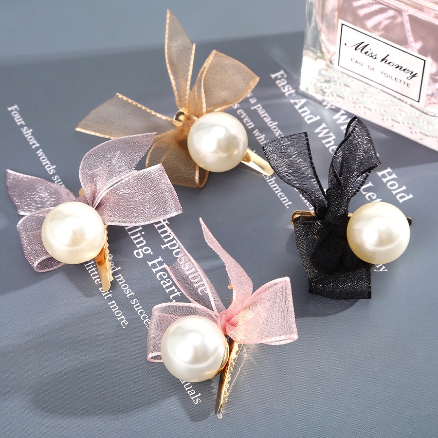 Kẹp tóc hình nơ đính ngọc trai xinh xắn dành cho nữ