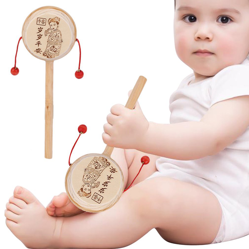 Đồ chơi trống lắc gỗ phát nhạc cho bé
