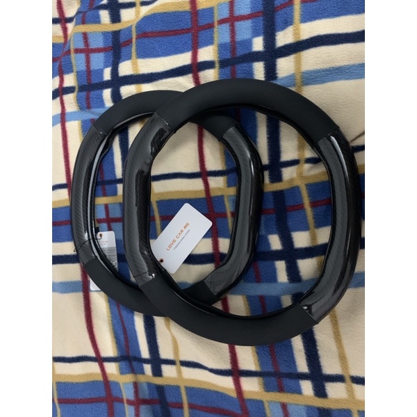 Bộc vô lăng Peugeot 2008/3008/5008 vân carbon đen