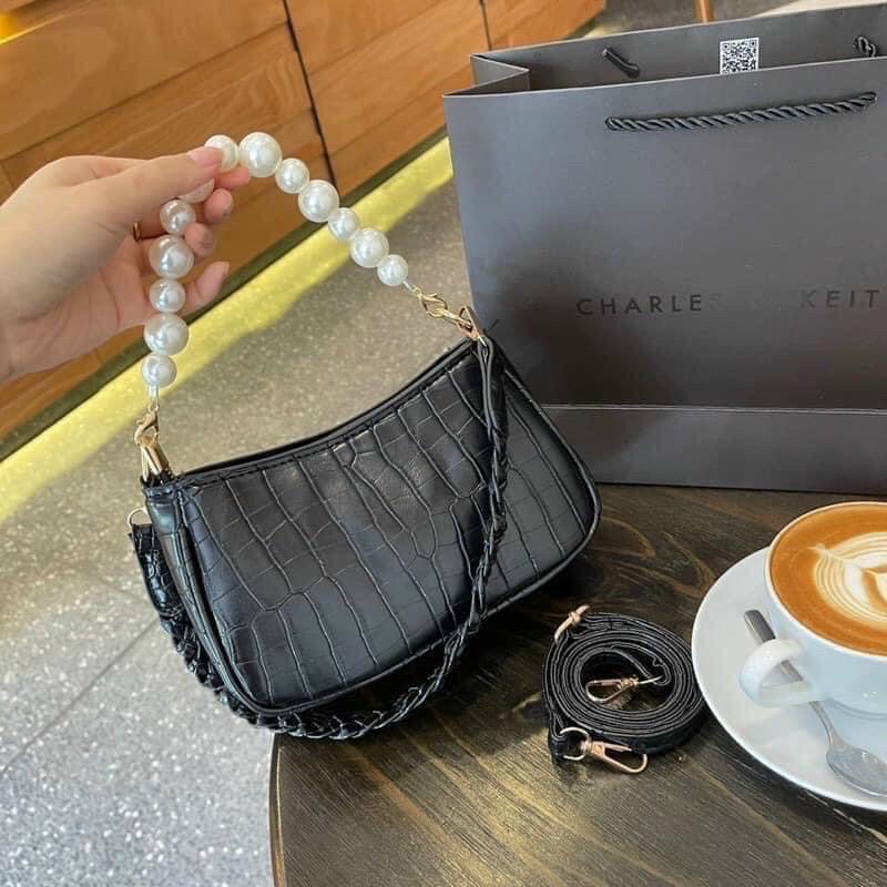Túi xách nữ cầm tay trang trí dây ngọc chai