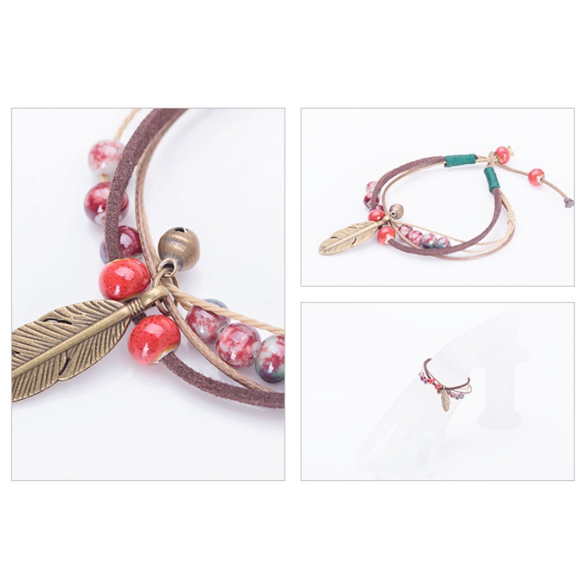 Vòng đeo tay hạt gốm lông vũ Clovershop68