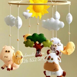 Treo nôi và khung gắn  cũi  nhạc pin 35 bài cho bé,tặng kèm tên bé