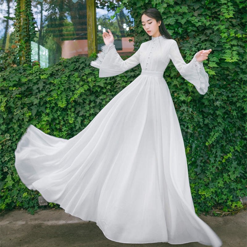 Đầm maxi trắng tay loe viền ren đính nút sang trọng