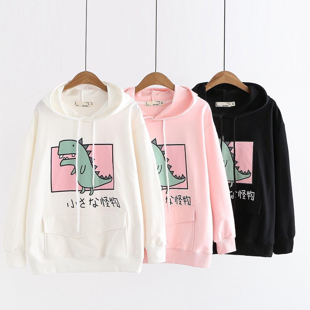 ÁO HOODIE CHUI ĐẦU NỮ MÀU TRẮNG VẢI NỈ HÌNH KHỦNG LONG TÚI VUÔNG | BigBuy360 - bigbuy360.vn