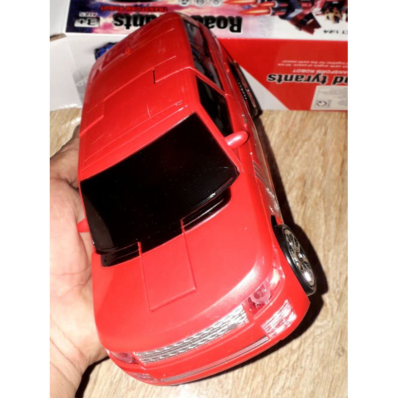 Một chiếc xe chạy pin biến hình thành robot bằng nhựa có nhạc và đèn led rất đep_tặng kèm pin